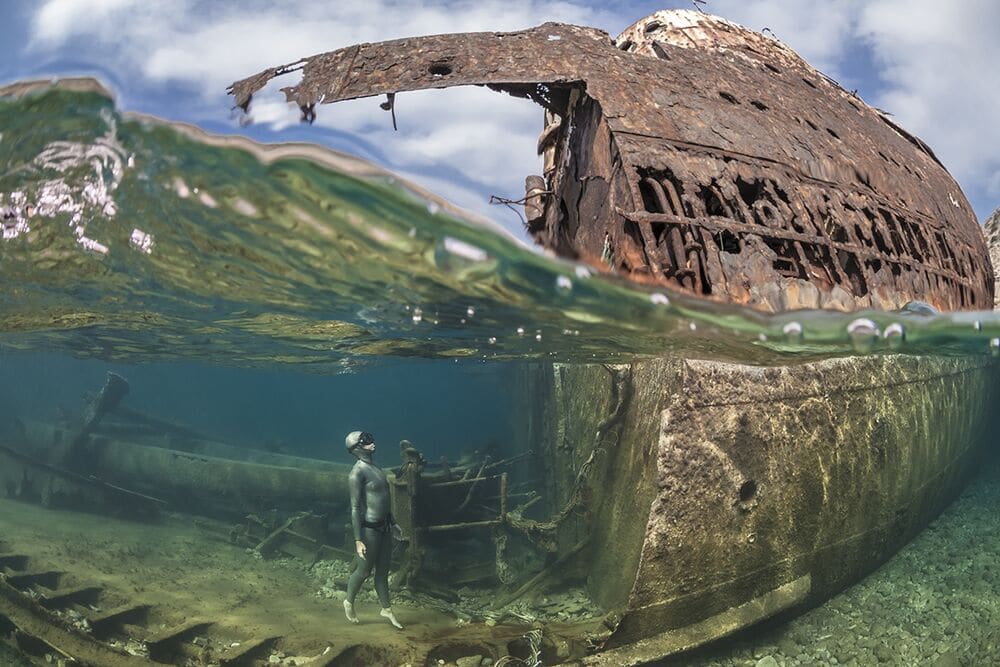 Diver Looking at a Shipwreck